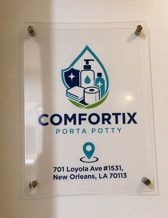 Clear acrylic Comfortix Porta Potty sign showing the suite address at the entrance